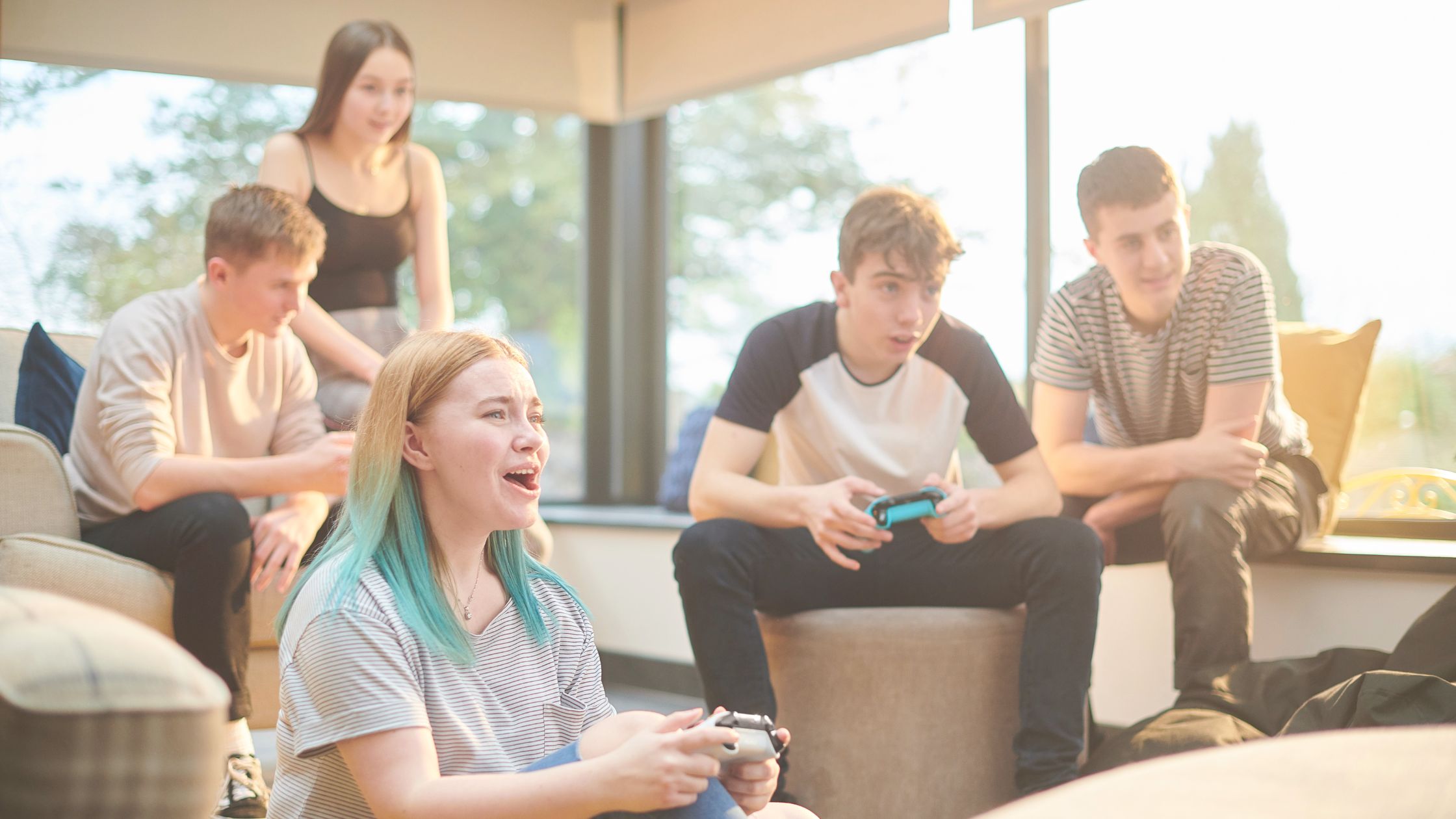 This image shows a group of teens enjoying a fun online gaming experience using Online Gaming Cards