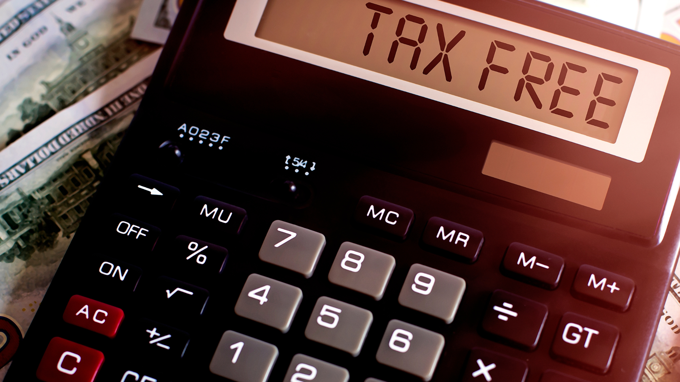 An image of a calculator with the words “tax free” displayed on the screen