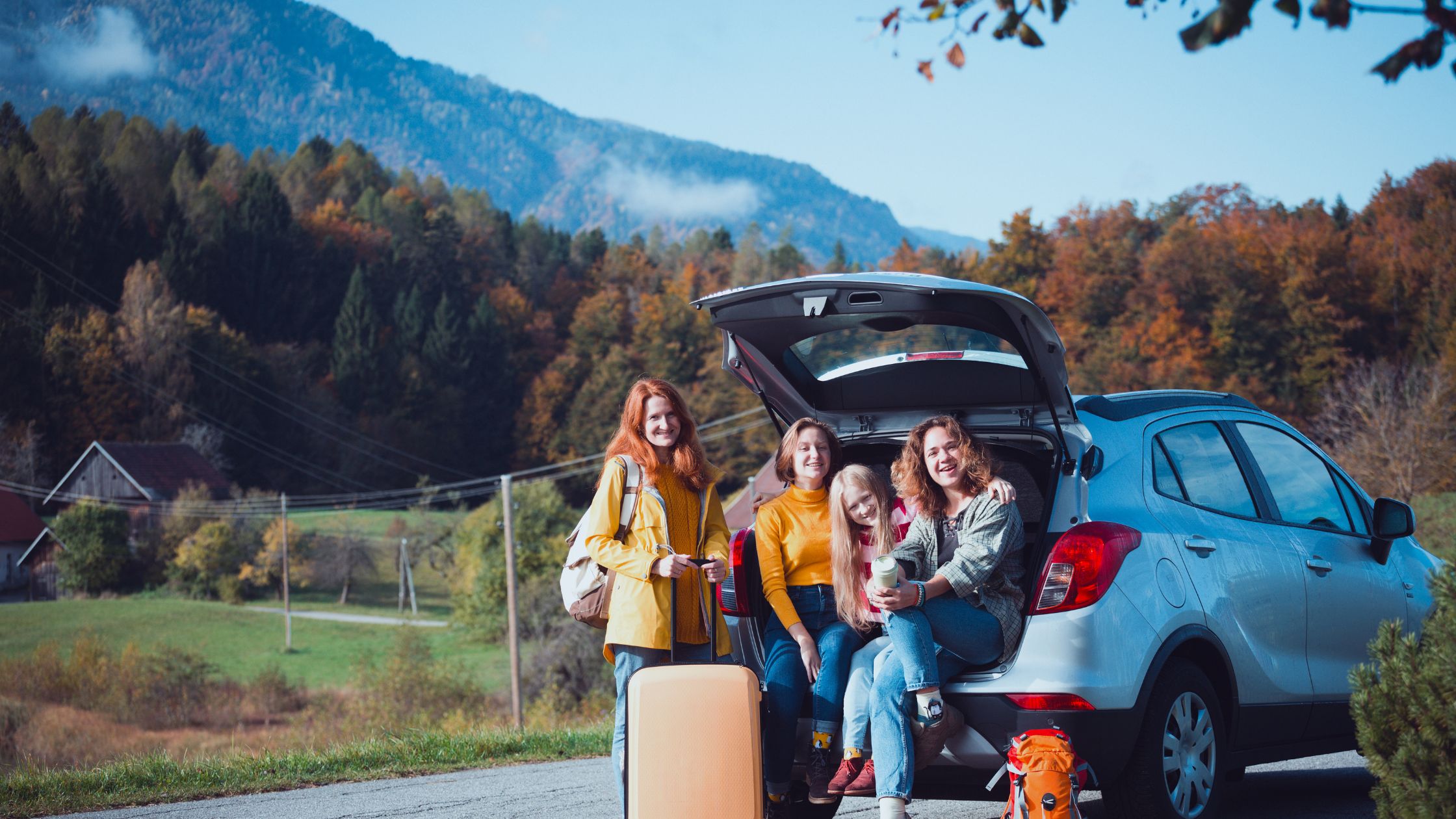 the image shows a family getting ready to go on a car journey with their bags packed ready to leave.